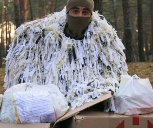 A soldier receives supplies and Mavkas for his military Unit from Uman Humanitarian center