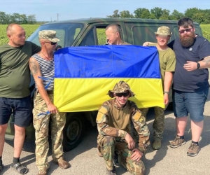 Soldiers accepting a vehicle from Uman Humanitarian Center